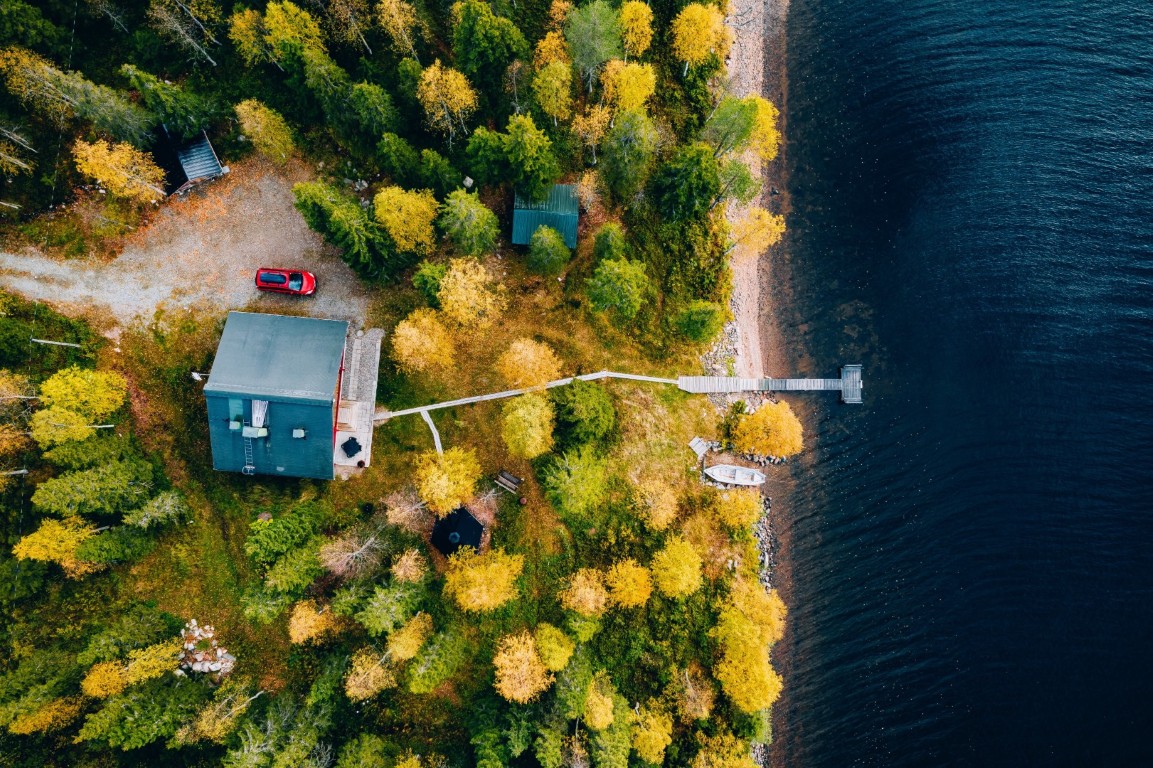 aerial view of cottage in autumn colors forest by 2025 03 18 15 24 52 utc